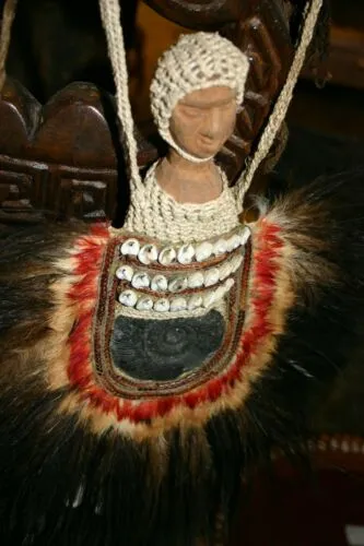 Rare Body Art : Dani Big Man Pectoral Trophy, Bride Price, Currency, Feud Payment Collectible: Ammonite, Cassowary, Seed beads, Bark Twine, Hand Carved Ancestor Face etc… late 1900’s. Museum Quality, Baliem Valley, Irian Jaya, New Guinea.