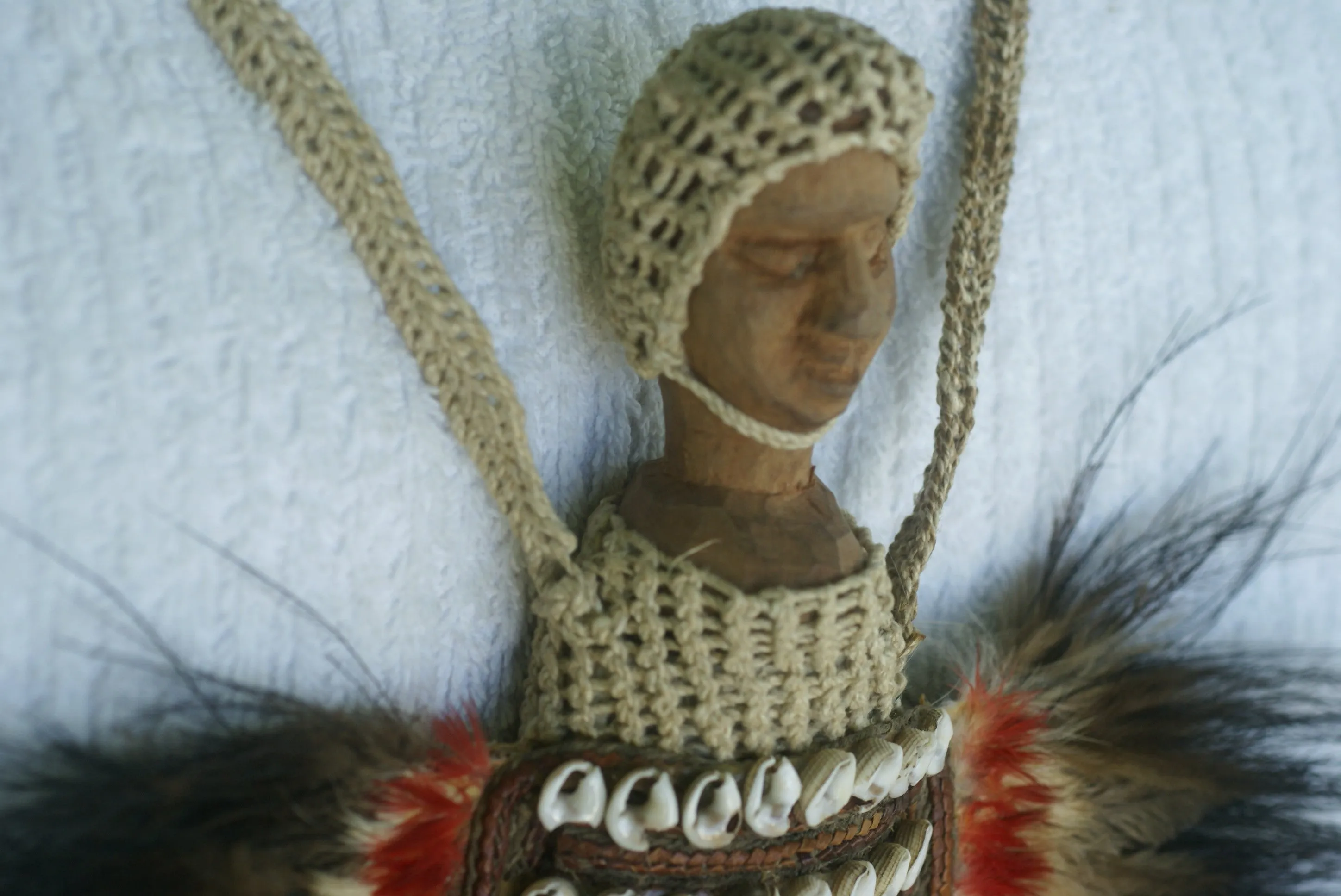 Rare Body Art : Dani Big Man Pectoral Trophy, Bride Price, Currency, Feud Payment Collectible: Ammonite, Cassowary, Seed beads, Bark Twine, Hand Carved Ancestor Face etc… late 1900’s. Museum Quality, Baliem Valley, Irian Jaya, New Guinea.