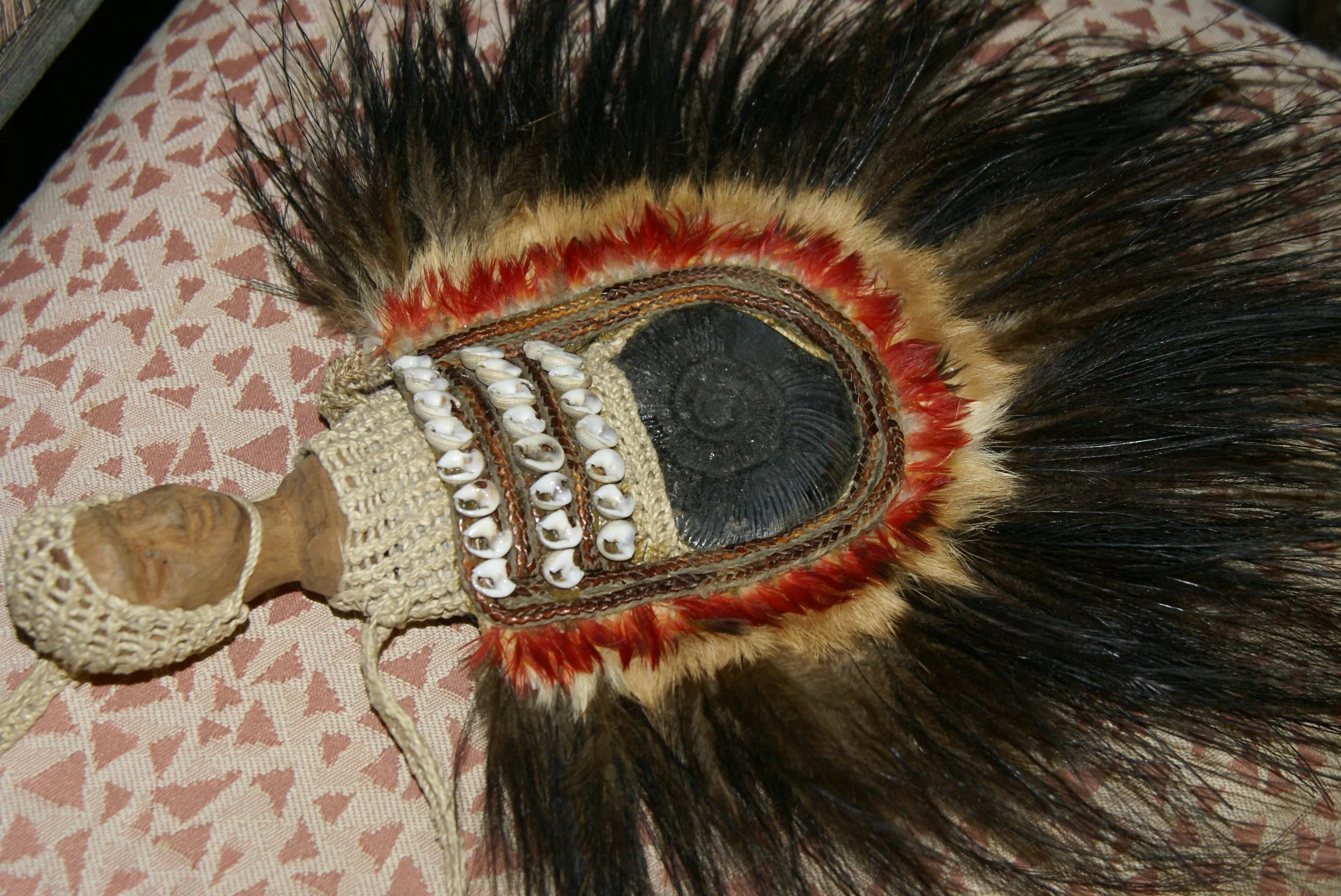 Rare Body Art : Dani Big Man Pectoral Trophy, Bride Price, Currency, Feud Payment Collectible: Ammonite, Cassowary, Seed beads, Bark Twine, Hand Carved Ancestor Face etc… late 1900’s. Museum Quality, Baliem Valley, Irian Jaya, New Guinea.