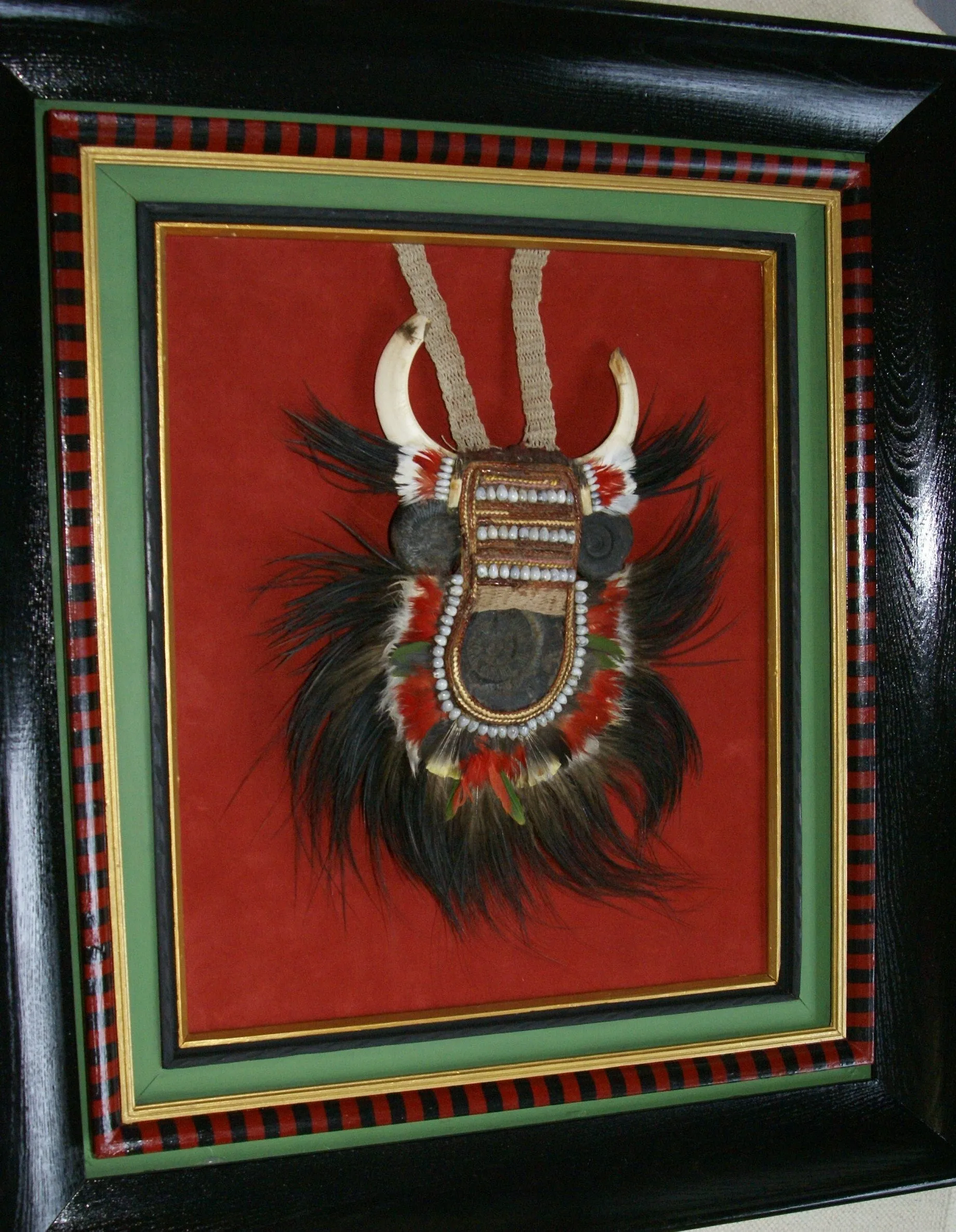 Rare Body Art : Dani “Big Man” Pectoral Trophy, Bride Price, Currency, Feud Payment, Highly Collectible: Ammonite, Boar Tusks, Cassowary, Seed beads, Bark Twine etc… Custom framed, 28” x 24 ½”, Collected in the late 1900’s. Museum Quality, New Guinea.