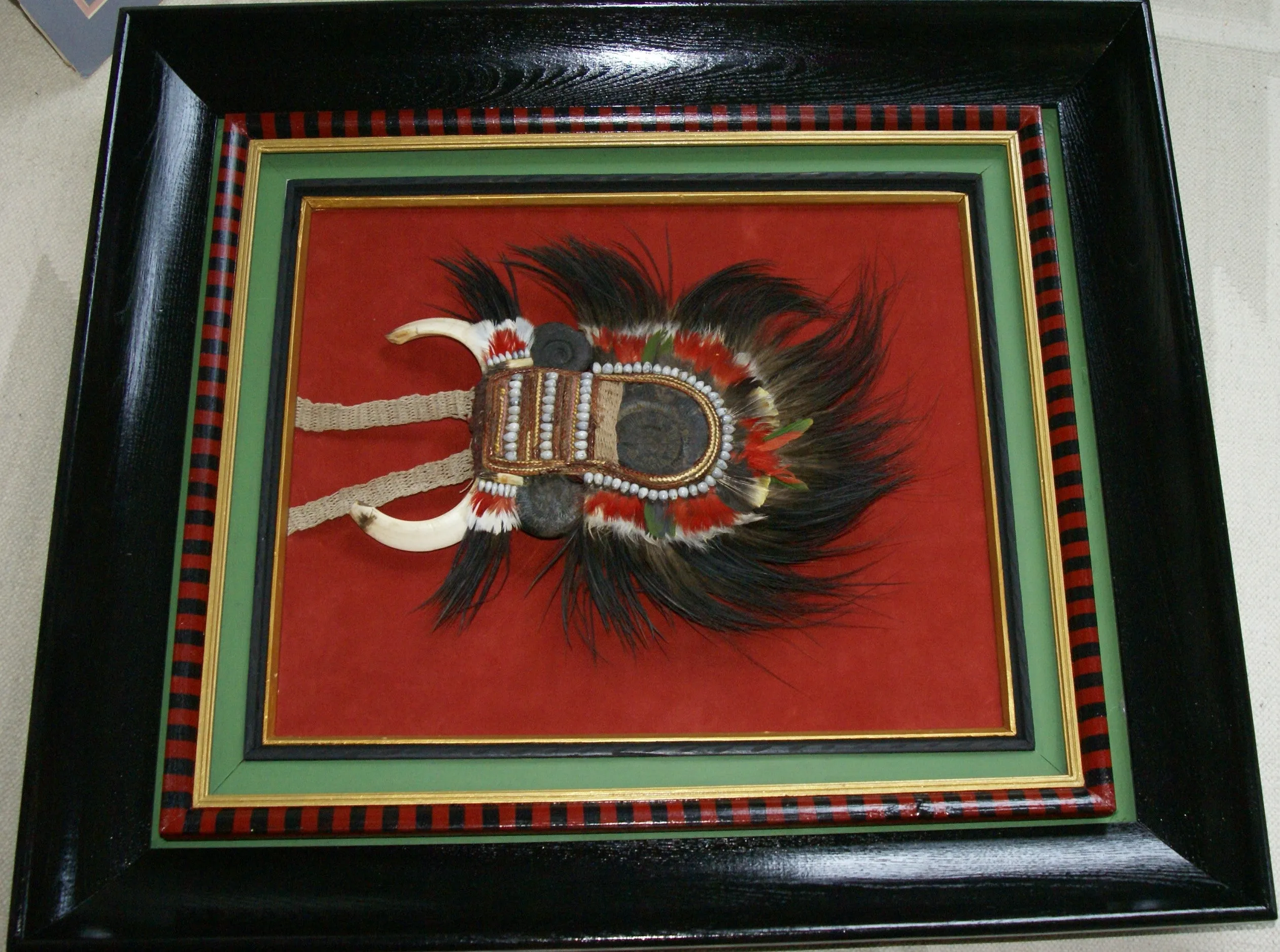 Rare Body Art : Dani “Big Man” Pectoral Trophy, Bride Price, Currency, Feud Payment, Highly Collectible: Ammonite, Boar Tusks, Cassowary, Seed beads, Bark Twine etc… Custom framed, 28” x 24 ½”, Collected in the late 1900’s. Museum Quality, New Guinea.