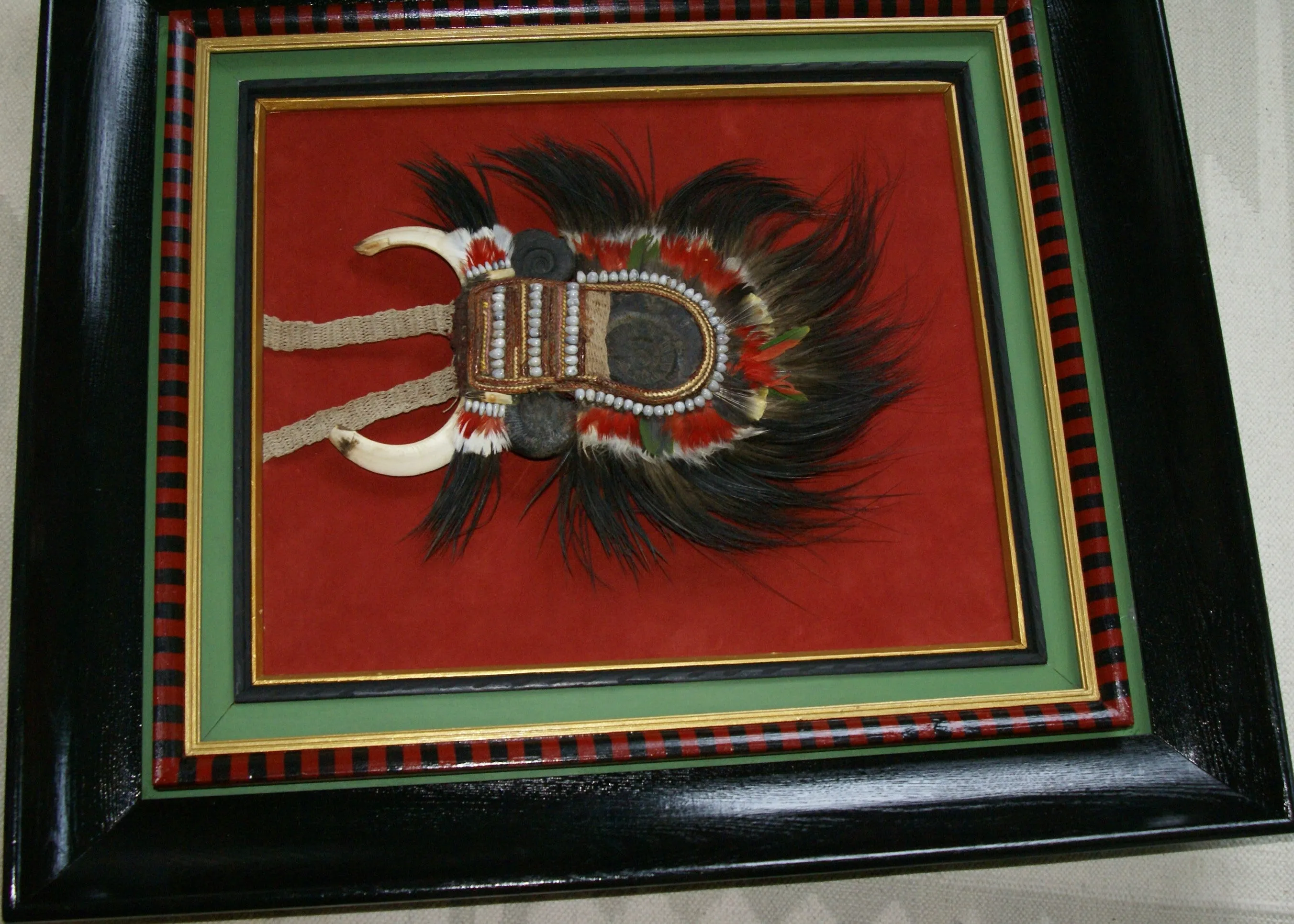 Rare Body Art : Dani “Big Man” Pectoral Trophy, Bride Price, Currency, Feud Payment, Highly Collectible: Ammonite, Boar Tusks, Cassowary, Seed beads, Bark Twine etc… Custom framed, 28” x 24 ½”, Collected in the late 1900’s. Museum Quality, New Guinea.