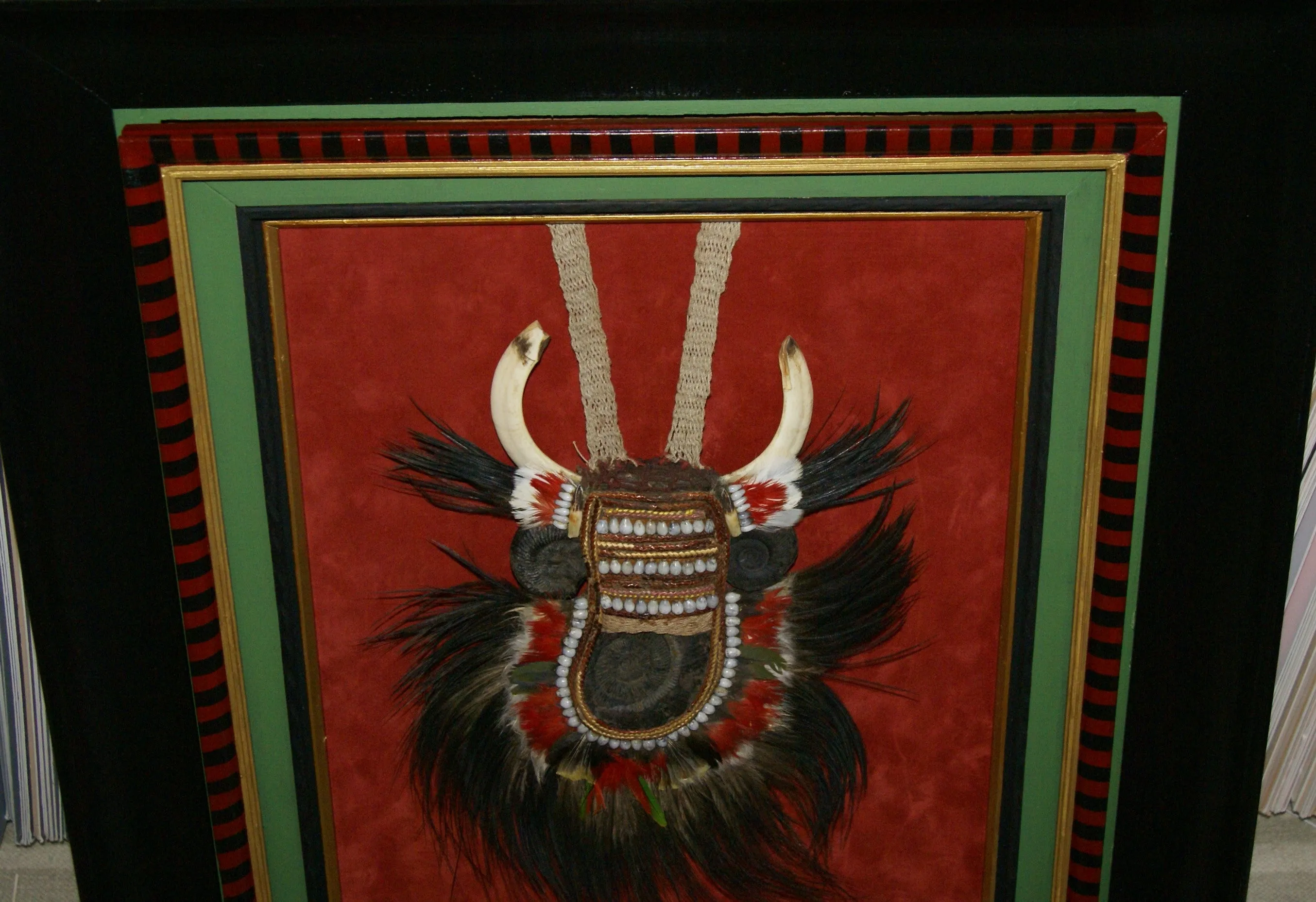 Rare Body Art : Dani “Big Man” Pectoral Trophy, Bride Price, Currency, Feud Payment, Highly Collectible: Ammonite, Boar Tusks, Cassowary, Seed beads, Bark Twine etc… Custom framed, 28” x 24 ½”, Collected in the late 1900’s. Museum Quality, New Guinea.